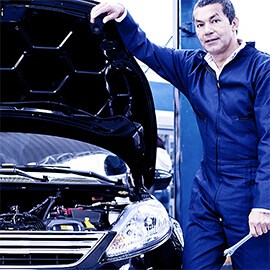 Mechanic Working On Car